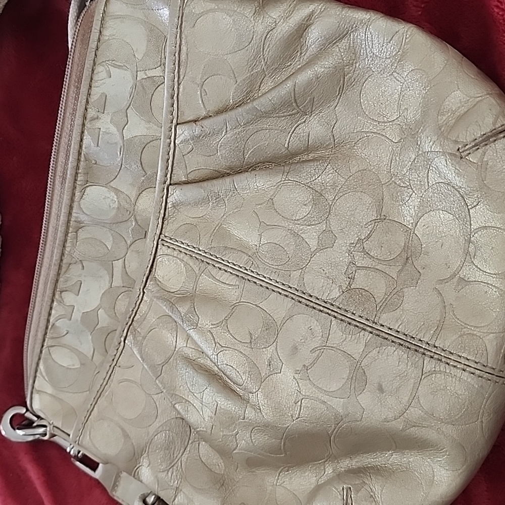 Its a Coach purse but not sure. No identifying numbers